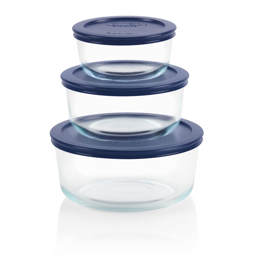 A view of a Pyrex Circular Glass Storage Box with blue lids